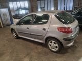 a picture of a silver car in a garage