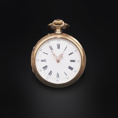 an antique pocket watch with roman numerals on a black background