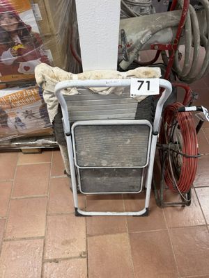 an image of a bicycle parked next to a stack of boxes