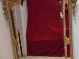 a mirror that is sitting on the floor in a room
