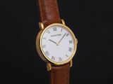 a close up of a wrist watch with roman numerals on it