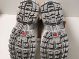the soles of a pair of running shoes on a white surface