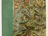 un vieux livre à la couverture verte ornée d'un motif marbré