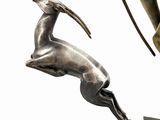 bronze statue of a man with a spear and a deer on a block