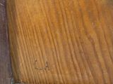a painting of a bird sitting on top of a wooden table