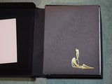 a black box with a gold design on it