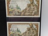 two framed images of a woman and child sitting on top of a table