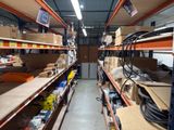 many shelves in the warehouse with boxes on them