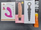 a box of sex products and a bottle of sex products on a table