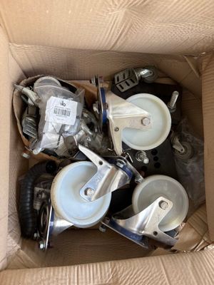 a cardboard box full of assorted items in it