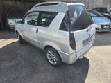 a silver car that is parked in a parking lot