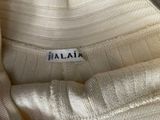 an image of a close up of a white shirt with a label on it