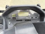 a close up of a motorcycle dashboard with a speedometer