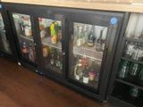 many bottles of alcohol on the shelves in the bar