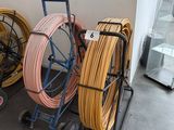 many different types of hoses on a cart in a room
