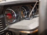 a close up of a car dashboard with a clock on it