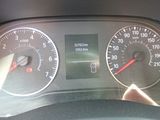 a close up of a car dashboard with a speedometer and gauges