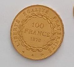 an image of a gold coin and a silver coin on a white surface