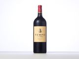 a bottle of red wine sitting on top of a table
