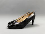 a pair of black leather shoes with a pointed toe