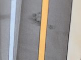 a close up of a tie with a yellow stripe