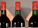 three bottles of wine that are sitting on a table