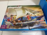 a box of playmobil with a boat on it