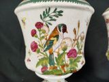 two vases that are decorated with birds and flowers