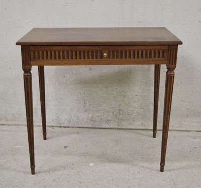 a small wooden table with a drawer on top of it