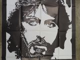 the poster for the movie ' s release shows a man with long hair and a beard