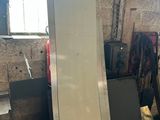 a lot of luggage sitting on a pallet in a room