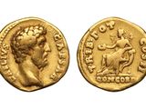 a gold coin with an image of a woman on it