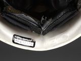 a close up of a helmet with a tag on it