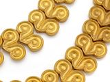 an image of a necklace made of gold colored beads on a white surface