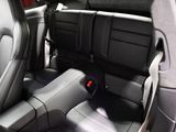 the back seats of a car with a remote control in it