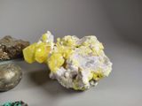 many different colored rocks and stones on a white surface