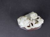 chinese carved jade figurine of a boy and a girl on a rock