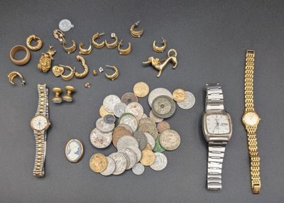 a lot of gold and silver jewelry on a table