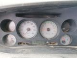 a close up of a car dashboard with various gauges and numbers