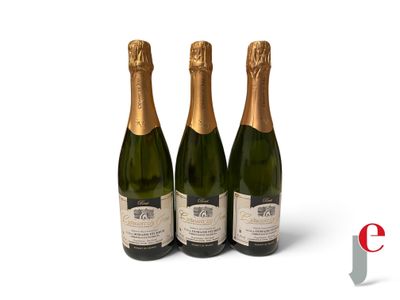 three bottles of champagne sitting next to each other on a white surface