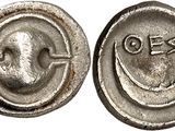 a close up of a coin with a smiley face on it