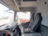 a view of the inside of a truck from the driver ' s seat