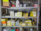 a metal shelving with lots of tools on top of it