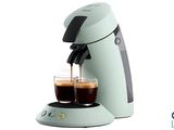 an image of a coffee maker with two cups of coffee in front of it