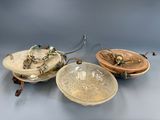 two bowls and a spoon are sitting next to each other