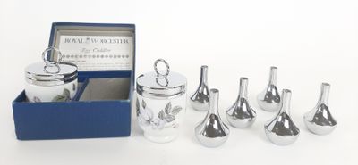 six glass vases in a blue box on a white surface