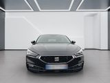 the front view of a black car in a white room