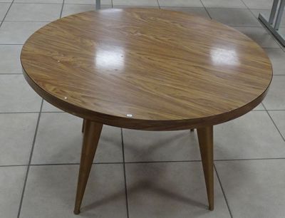 a small table with a wooden top on a tiled floor