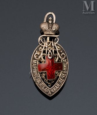 a close up of a badge with a red cross on it