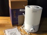 a box of tissues and a blender sitting on a table